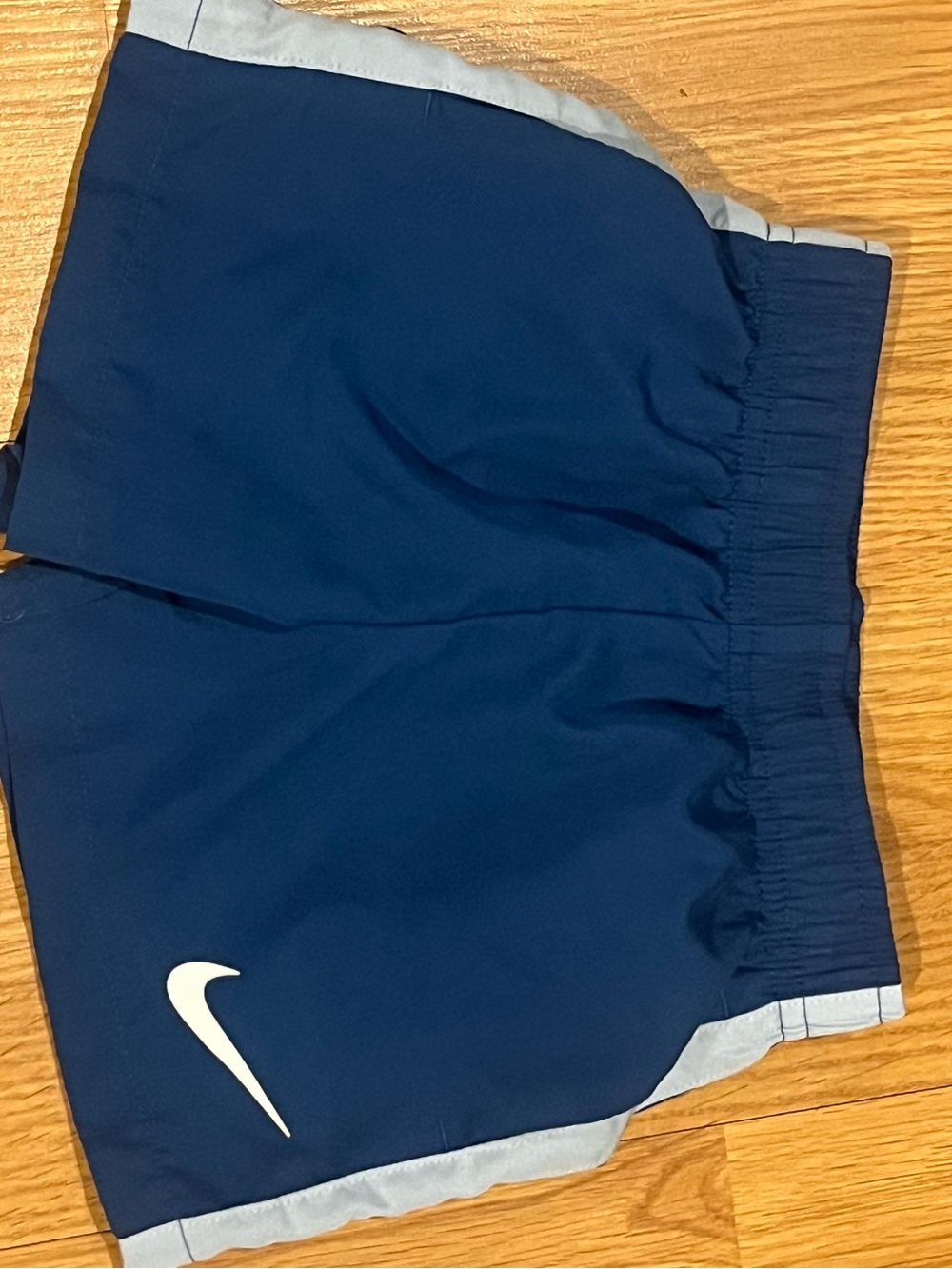 Nike Dark Blue Kids Shorts with Light Blue Trim and White Swoosh Size 12months
